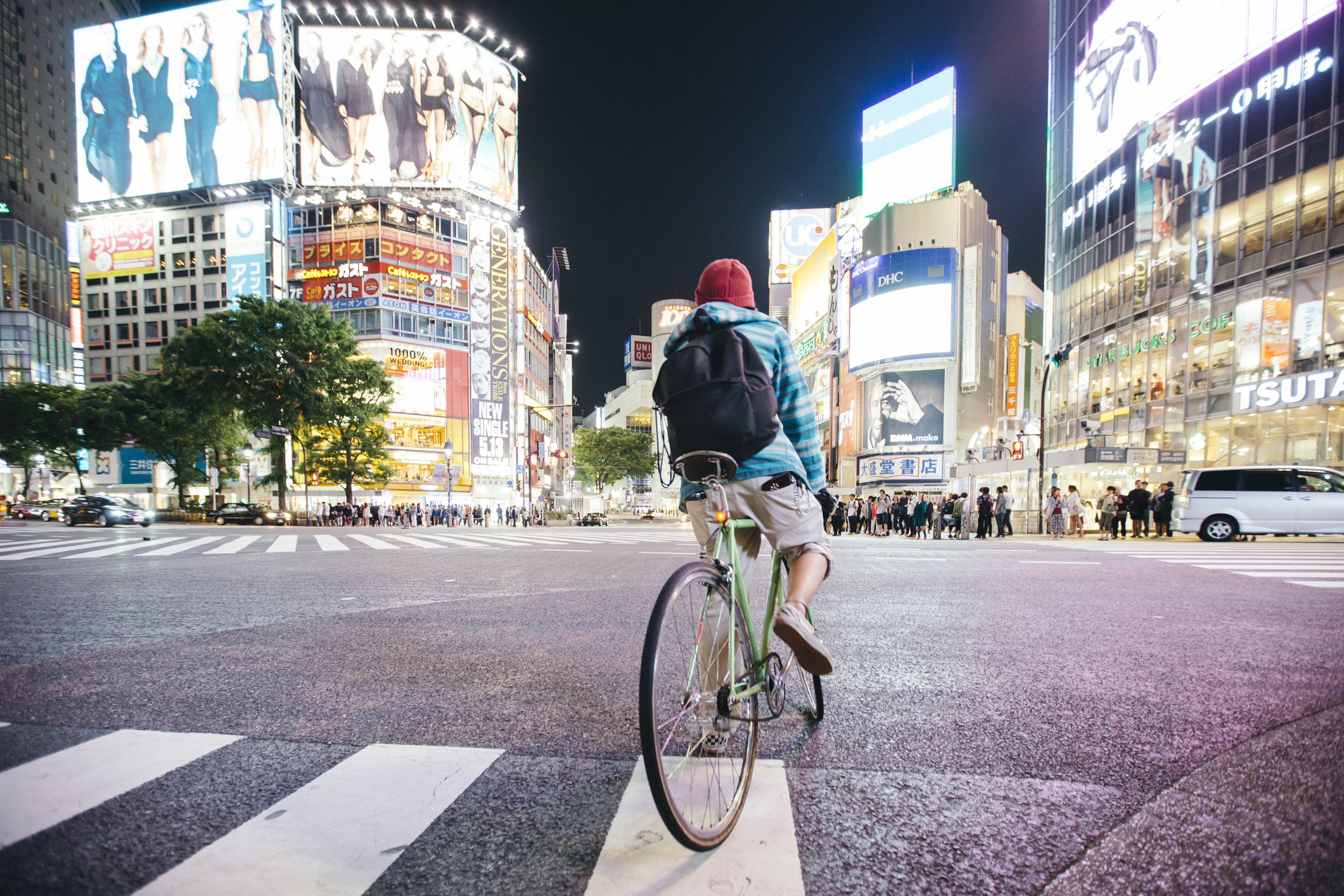 Man riding a bike in the city centre of Tokyo